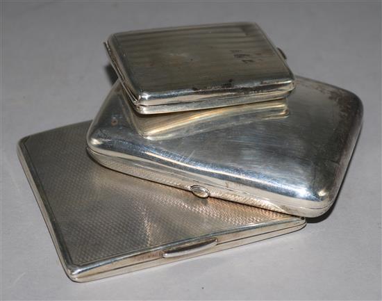 Two silver cigarette cases & a matchbook holder.